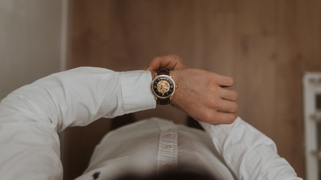 Boutique advisor presenting a watch case to a client in a private salon