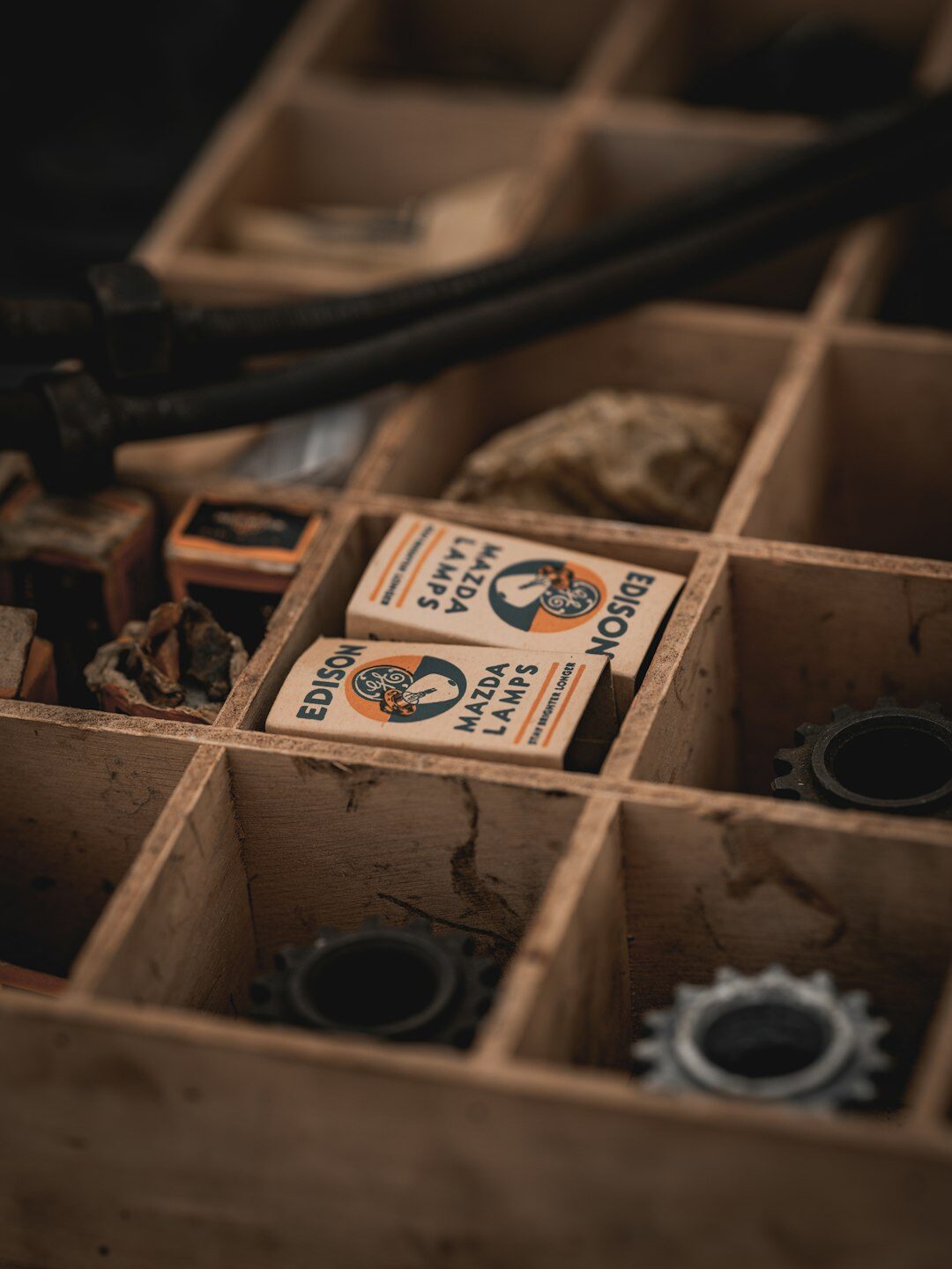 Vintage chronograph watch with a patinated dial on a wooden box