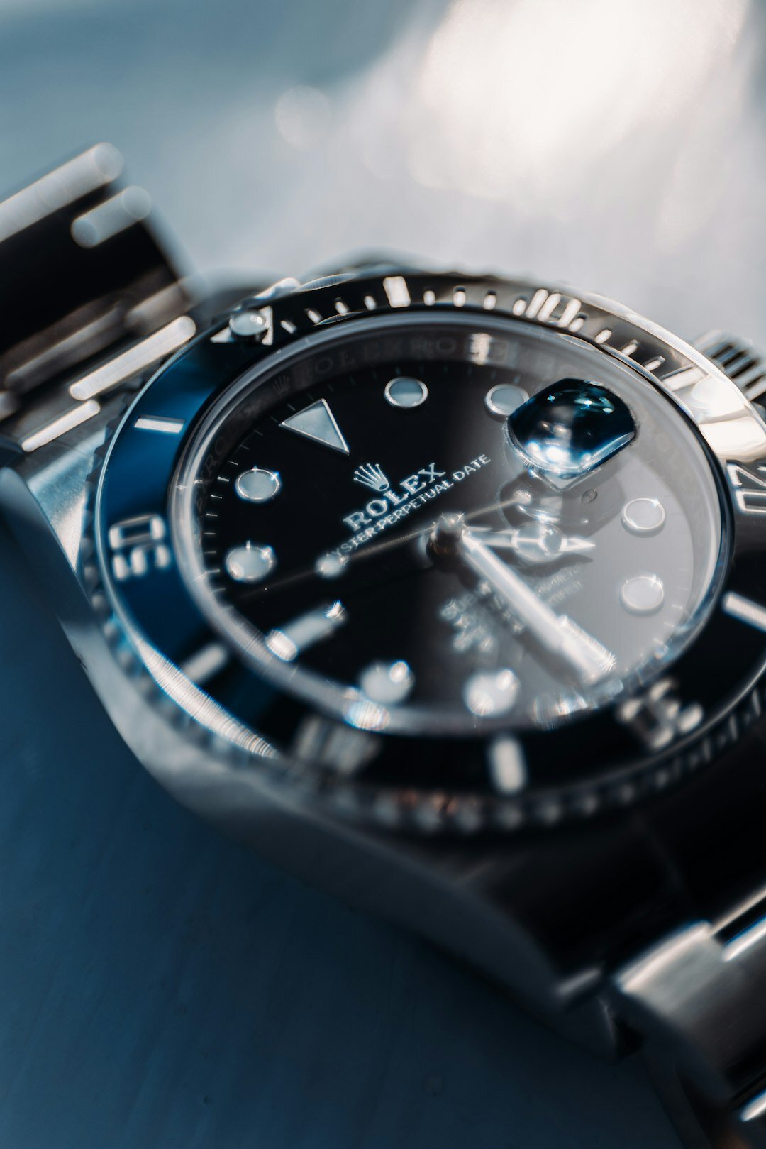Luxury dive watch on a sailor's wrist aboard a yacht