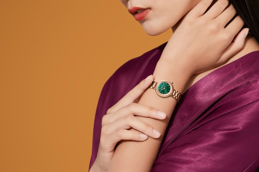 Elegant woman's wrist wearing a diamond-set jewelry watch