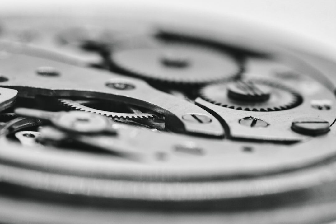 Macro photo of a Swiss tourbillon watch movement with visible gears